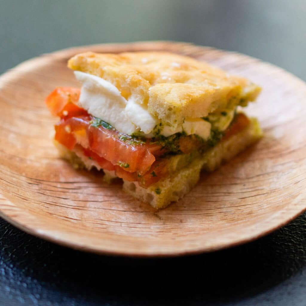 A focaccia sandwich on a plate from Frascati Market