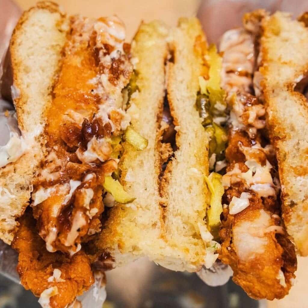 A cross section of a fried chicken sandwich from Just Chicken