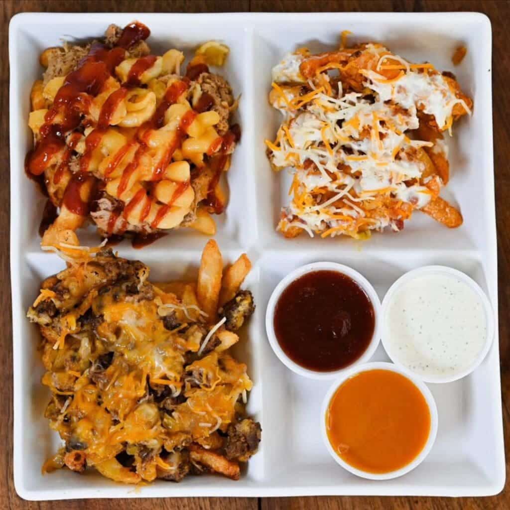 A platter of chicken, mac and cheese, and fries from Taesty's