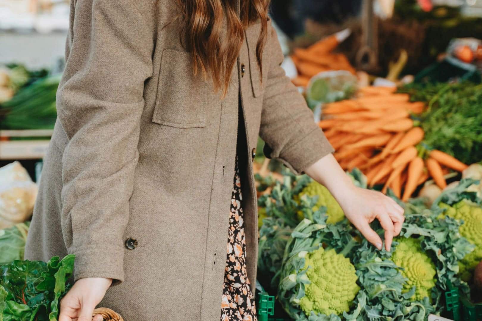 Woman walking at The Little Grand Farmer's Market.