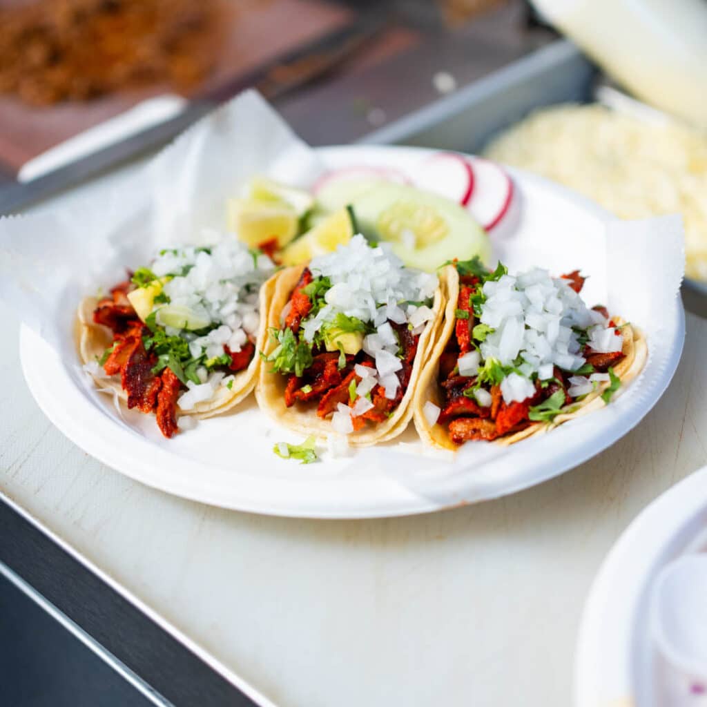 Al Pastor Tacos on a white plate