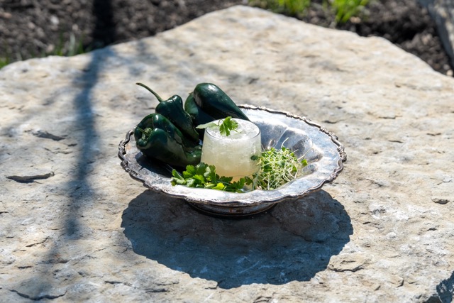 Paola Punch cocktail at The Little Grand Market with bright herbal garnish